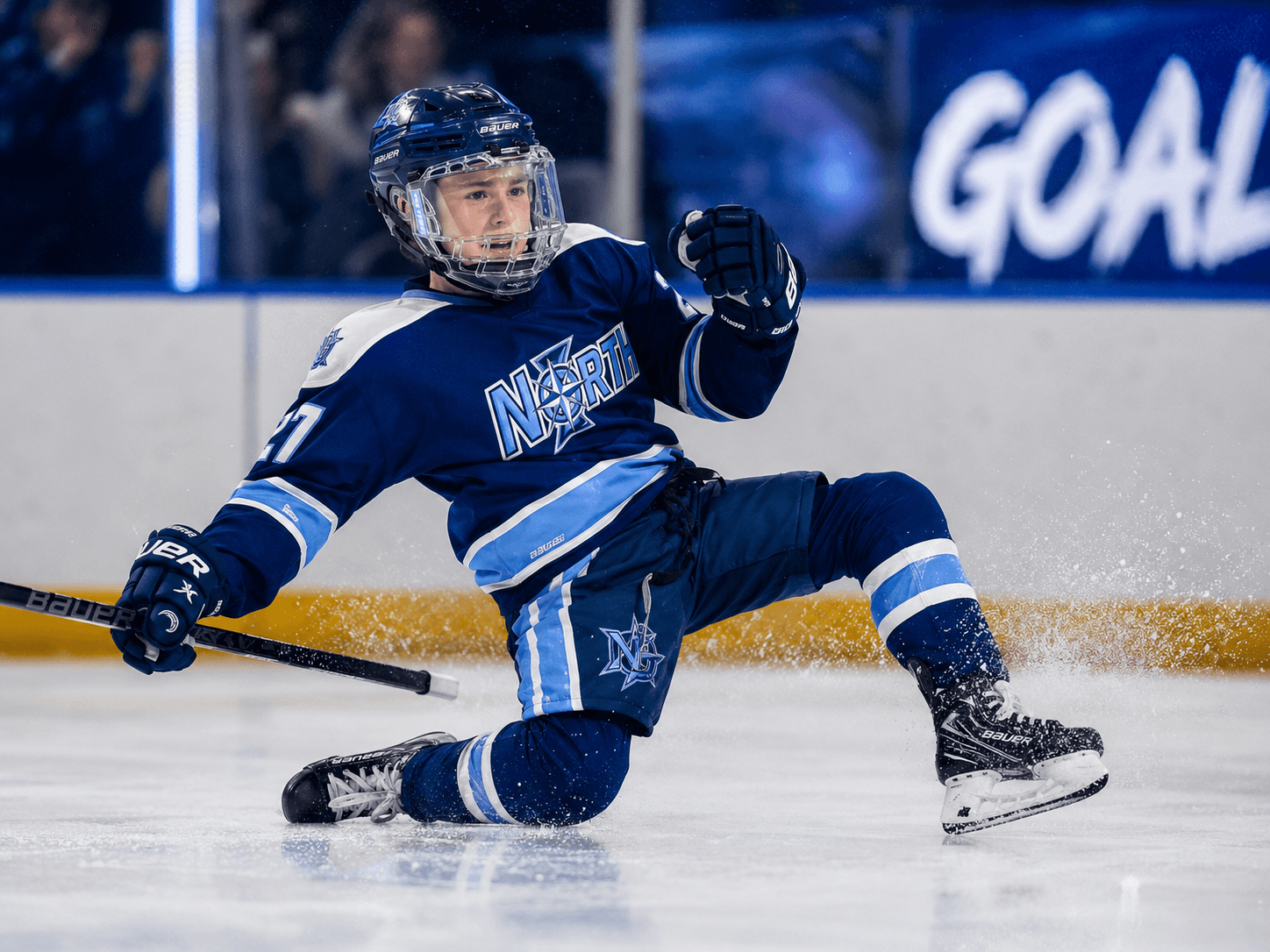 Youth hockey player celebrating a goal